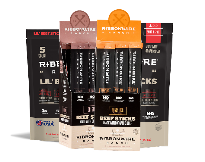 Ribbonwire Ranch beef sticks packaging display with multiple black and beige pouches and stick packs arranged together on a white studio background.
