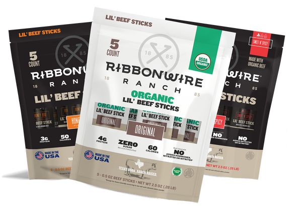 Three bags of Lil' Beef Sticks by Ribbon Wire Ranch arranged in a fan shape on a white background, showing different flavor and organic options.